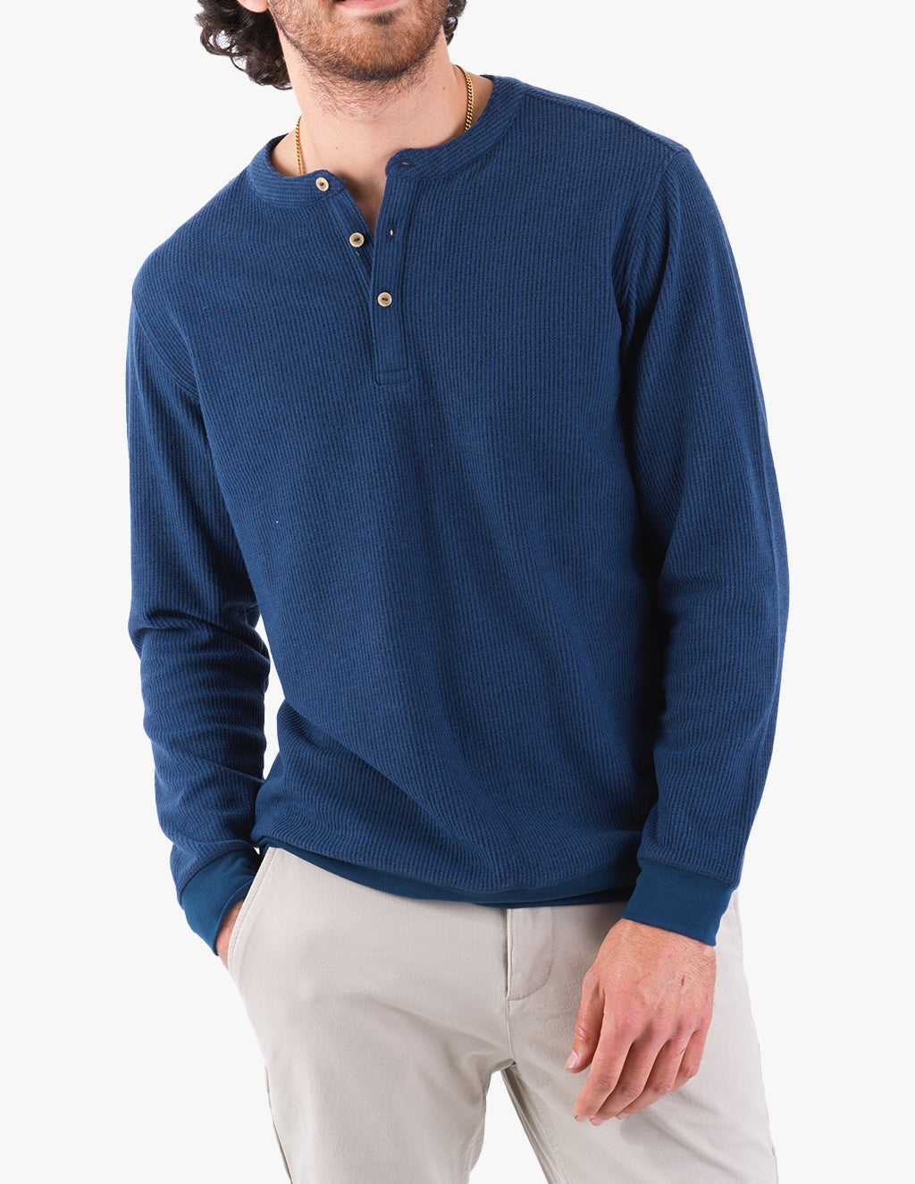 Model wearing a navy waffle-knit henley shirt with buttons