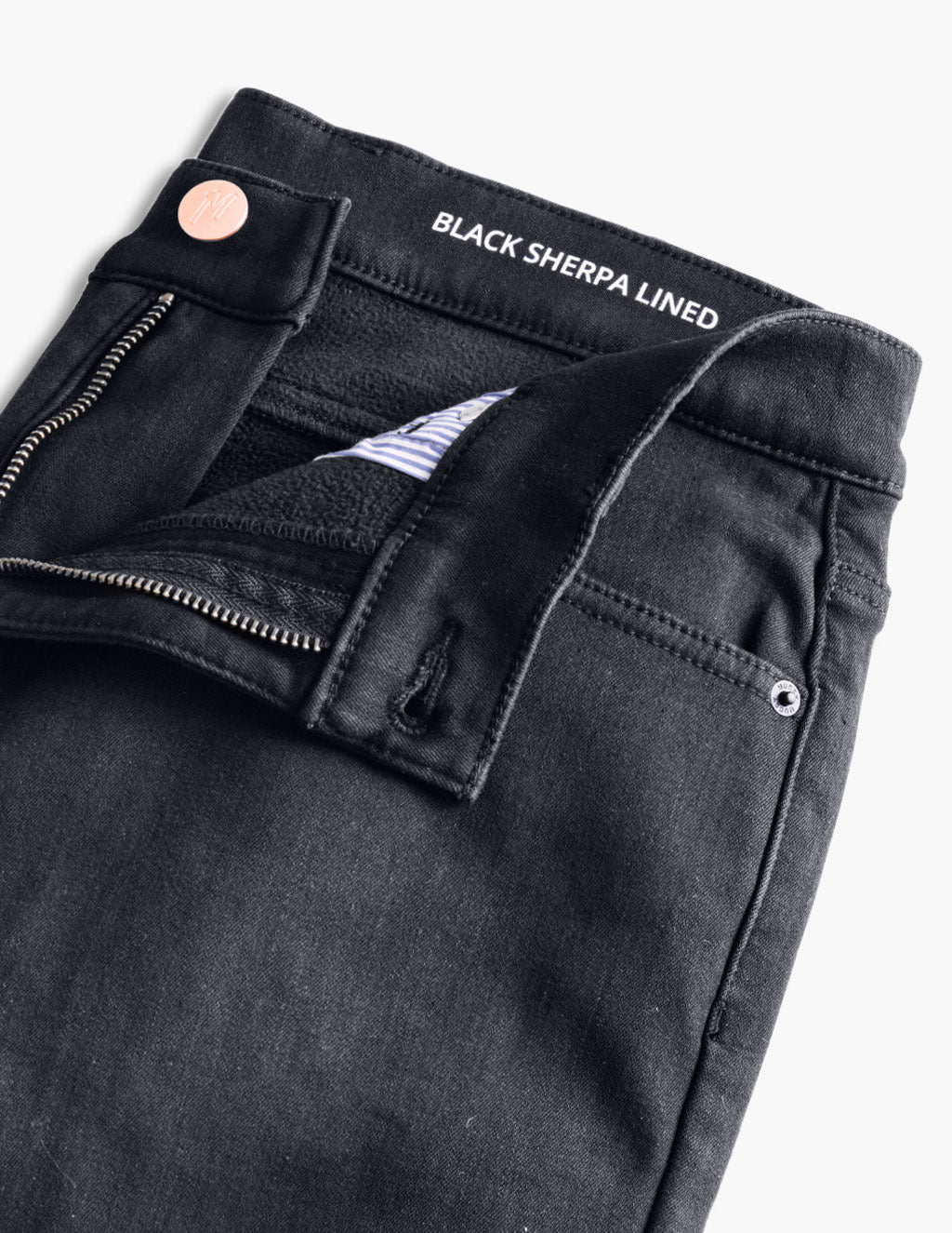 Black pants with open zipper showing striped inner lining and BLACK SHERPA LINED printed on the waistband.