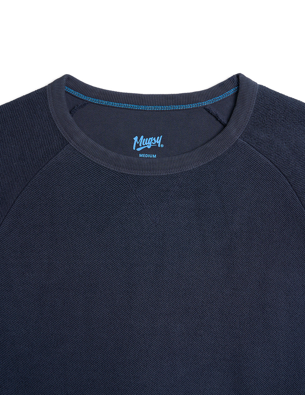 Navy crewneck sweatshirt neckline with blue stitching, 'Mugsy' logo and 'MEDIUM' size label