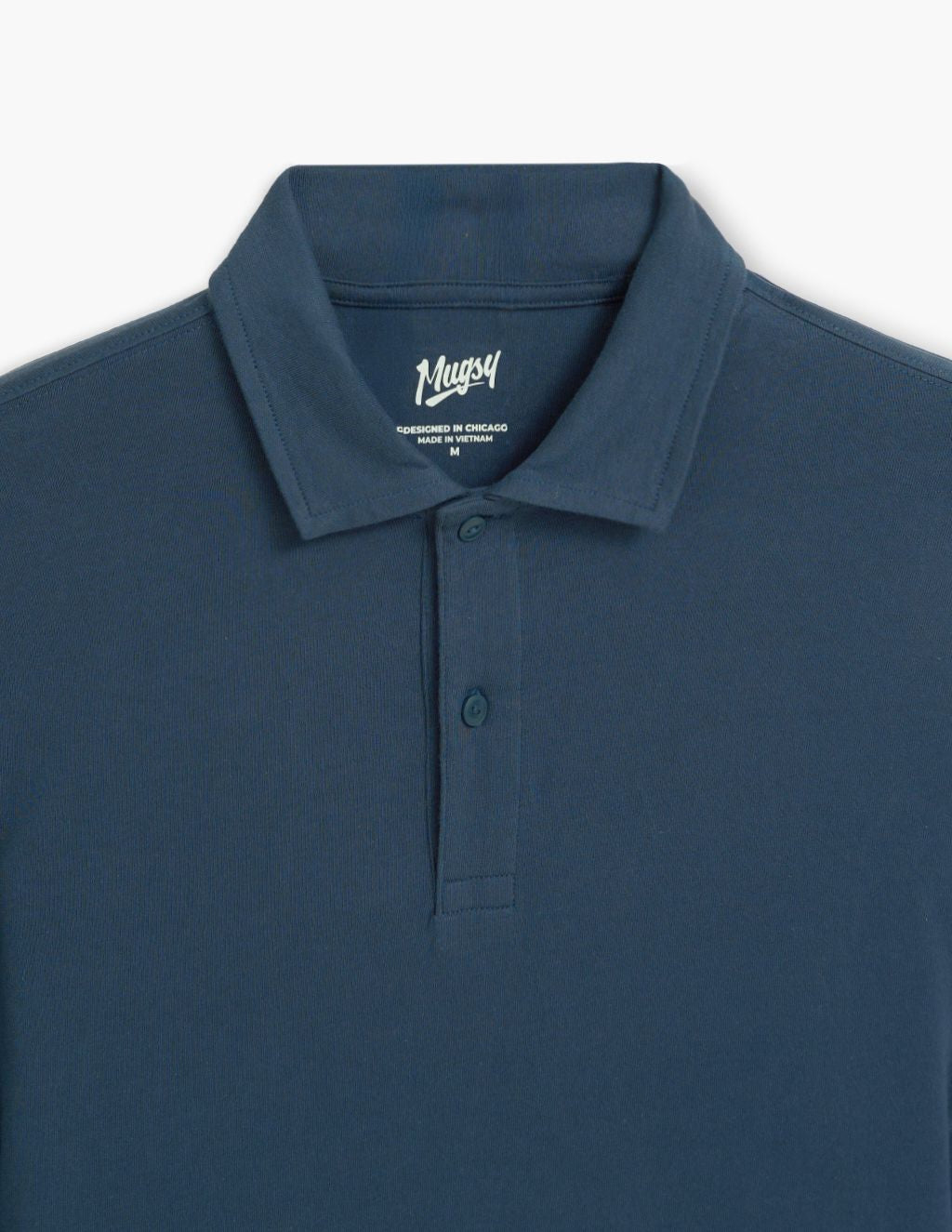 Blue polo shirt collar and two-button placket; interior label reads Mugsy, DESIGNED IN CHICAGO, MADE IN VIETNAM, M