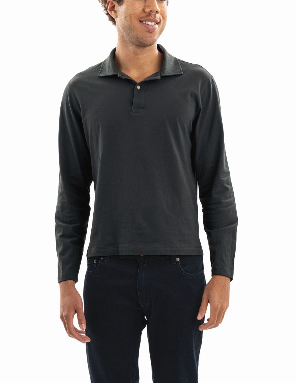 Male model wearing charcoal long-sleeve polo shirt and dark jeans on white background.