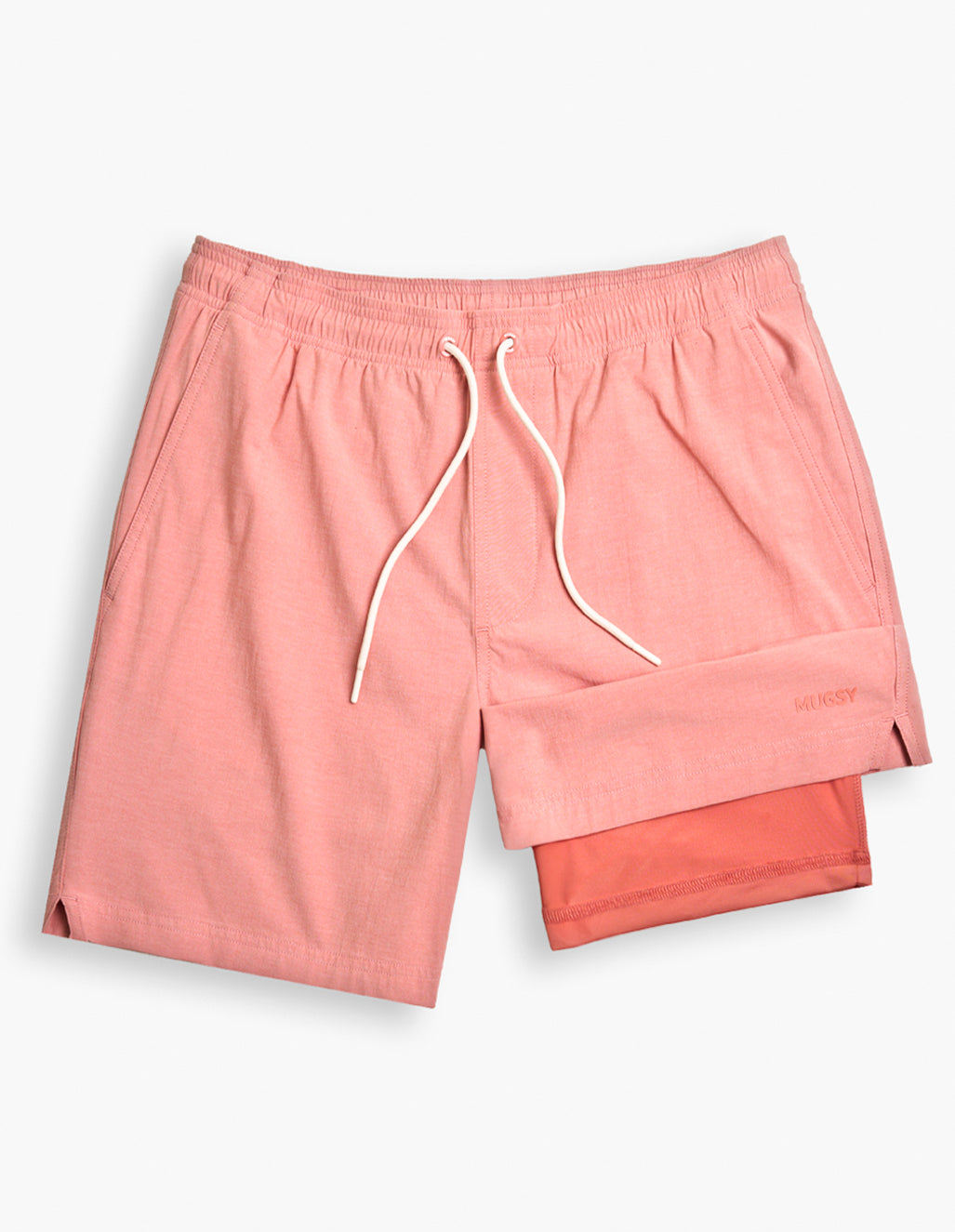 Pink casual shorts with white drawstring and visible brand name 'MUGSY' embroidered on the lower right leg.