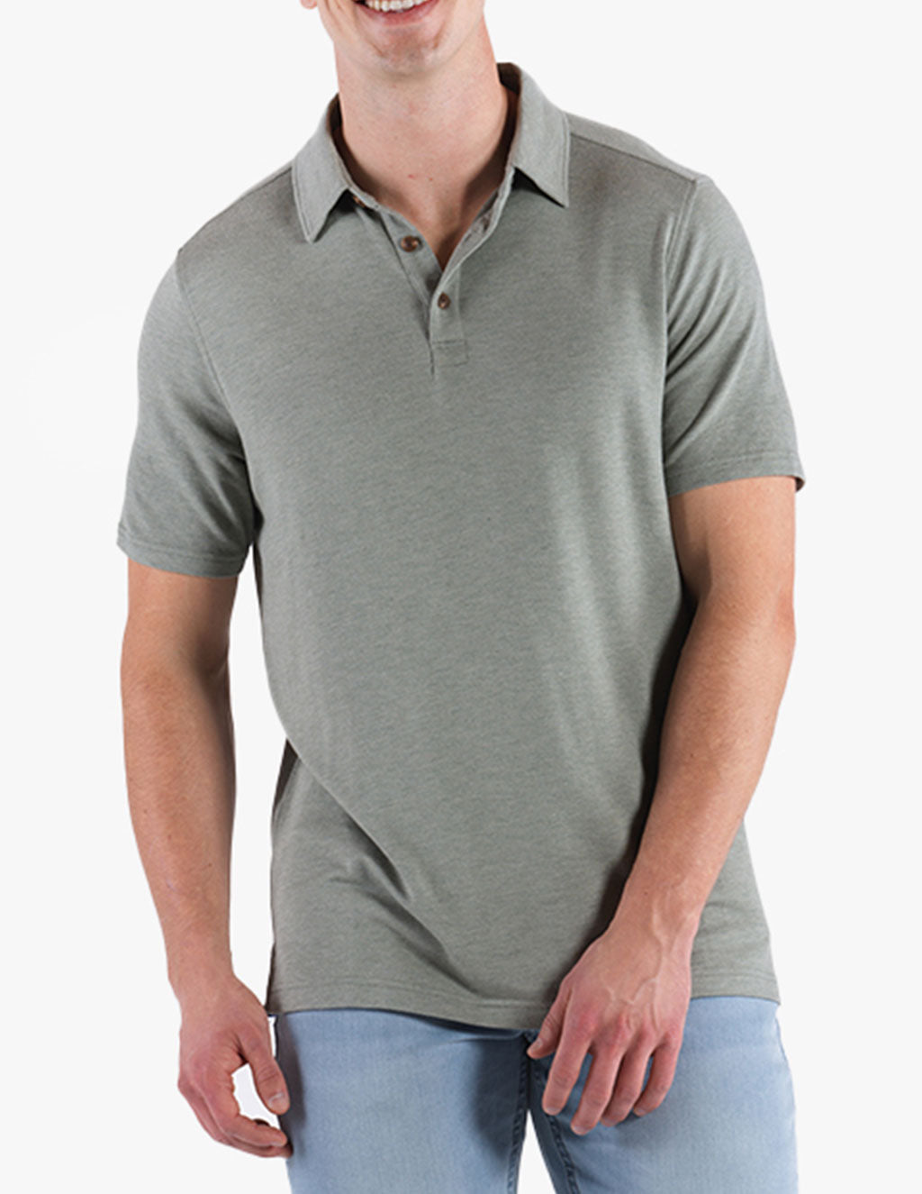 Model wearing a washed green polo shirt with a collar and short sleeves.