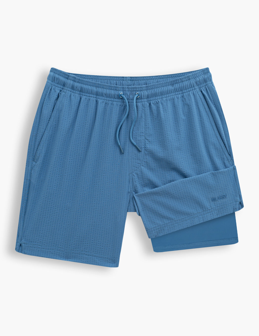 Flatlay of men's Pacifics blue swim shorts showing textured fabric, drawstring waist and inner liner