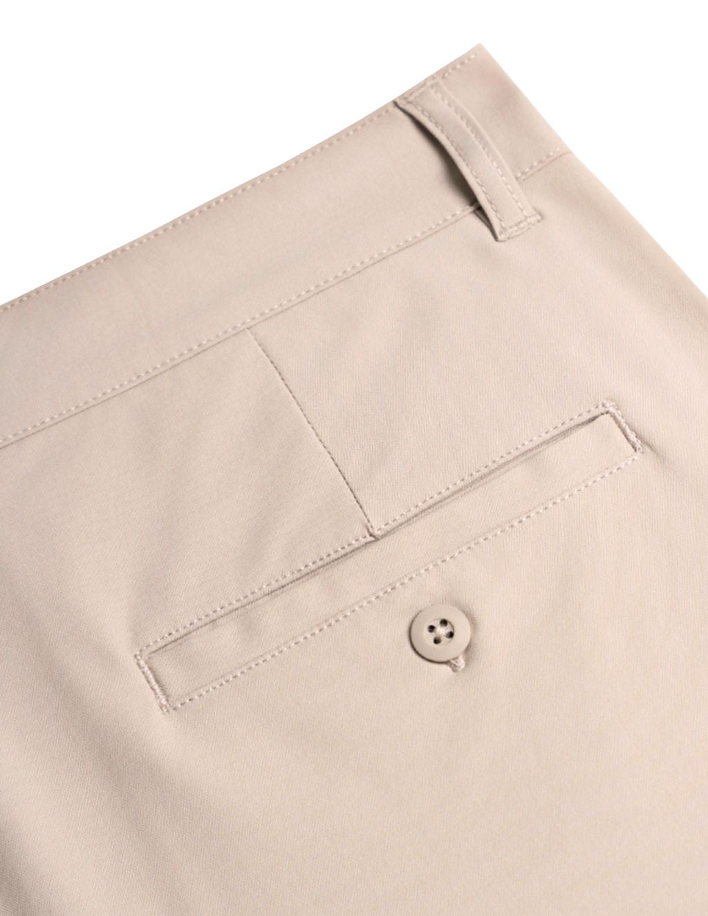 Beige dress pants back-pocket close-up showing welt pocket, button and belt loop.