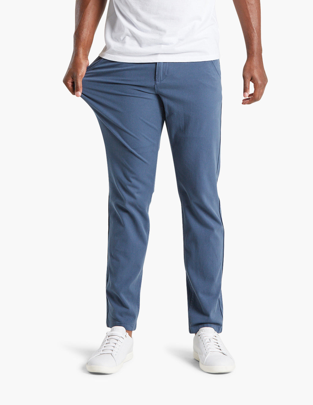 Model wearing blue stretchy chinos, showcasing flexibility and comfort.