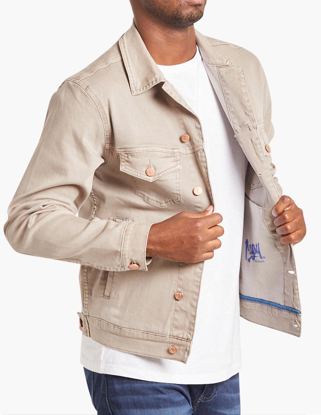 Model wearing a tan stretch denim jacket with open front and visible pockets