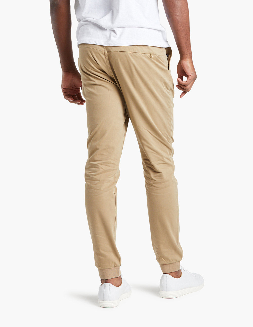 Khaki joggers with elastic cuffs, ideal for travel, shown from the back