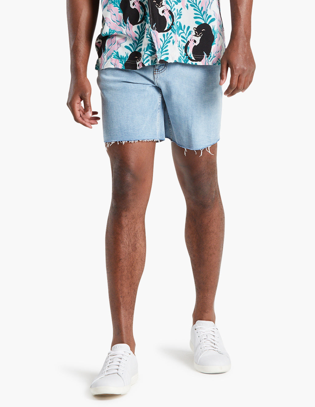 Model wearing vintage blue stretch jorts, showcasing fit and style.