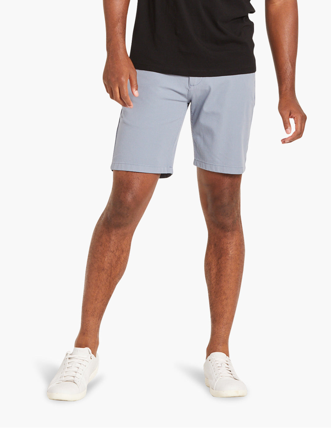 Men's blue stretch chino shorts worn by a model, showcasing summer style.