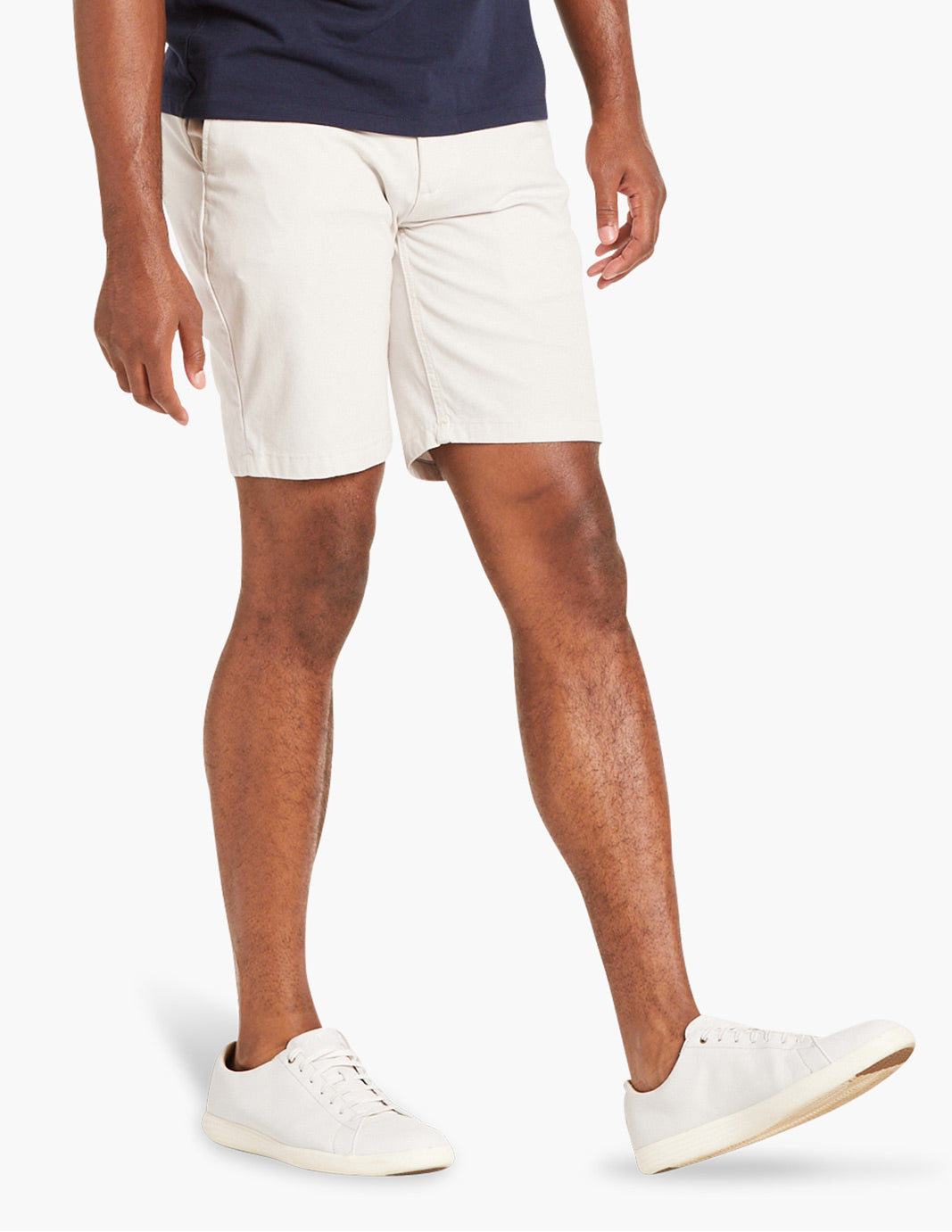 Model wearing best men's stretch chino shorts in white, ideal for summer.