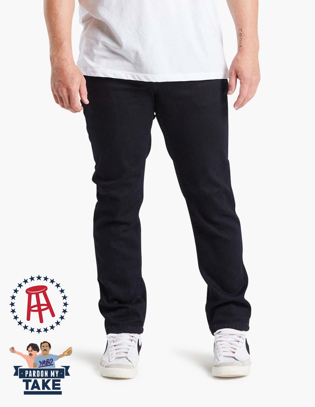 Model wearing Barstool Mugsy clutch jeans in dark blue with logo