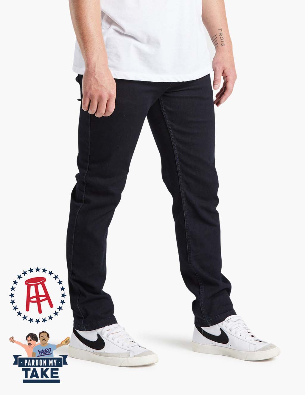 Model wearing Barstool Mugsy clutch jeans in dark blue with logo from Pardon My Take
