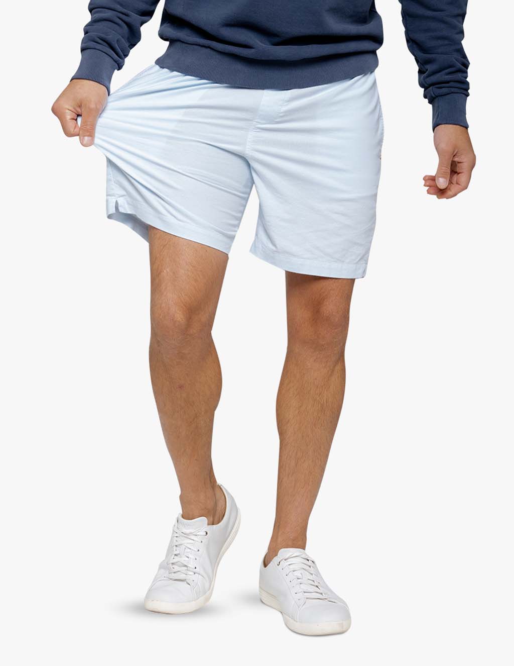 Light blue stretch drawstring shorts worn by a model