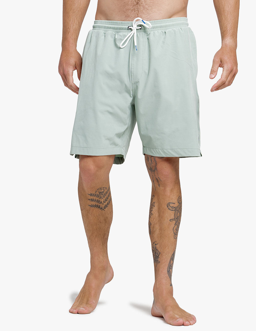 Men's solid green stretch swimsuit, part of the buy 2 pairs, get a free hat promotion.