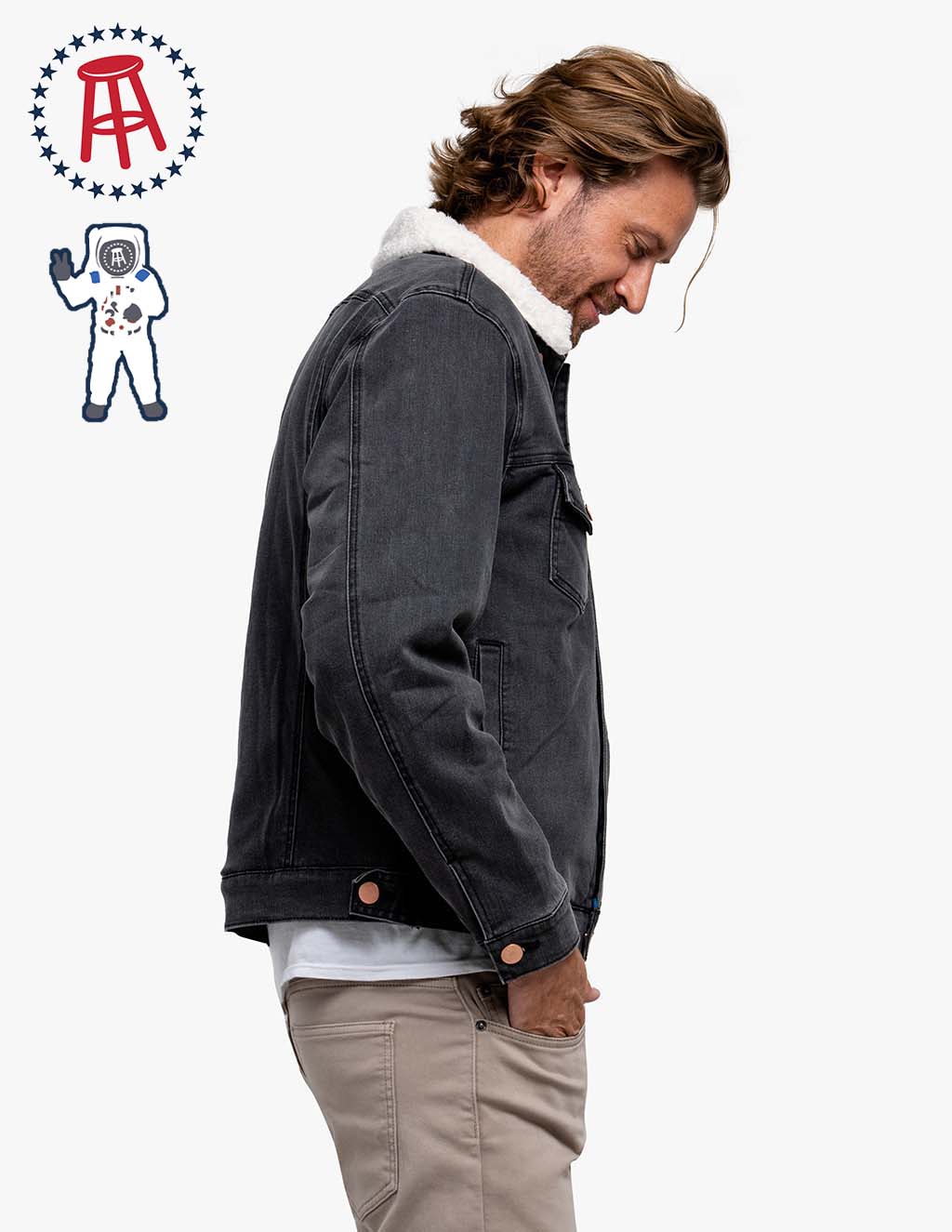 Side view of a black sherpa-lined denim jacket with Barstool logo and astronaut graphic